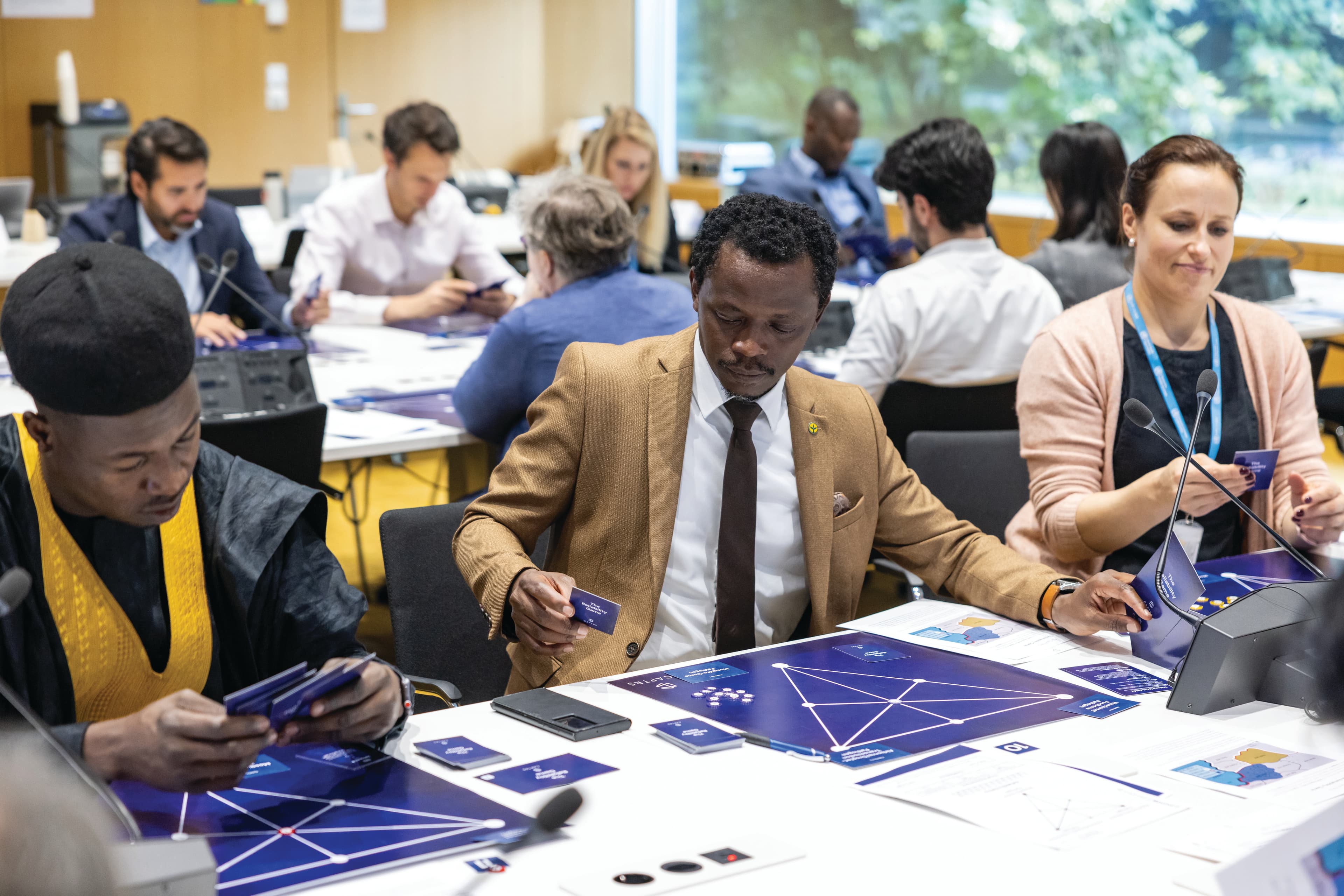 Team discussion around board game simulation